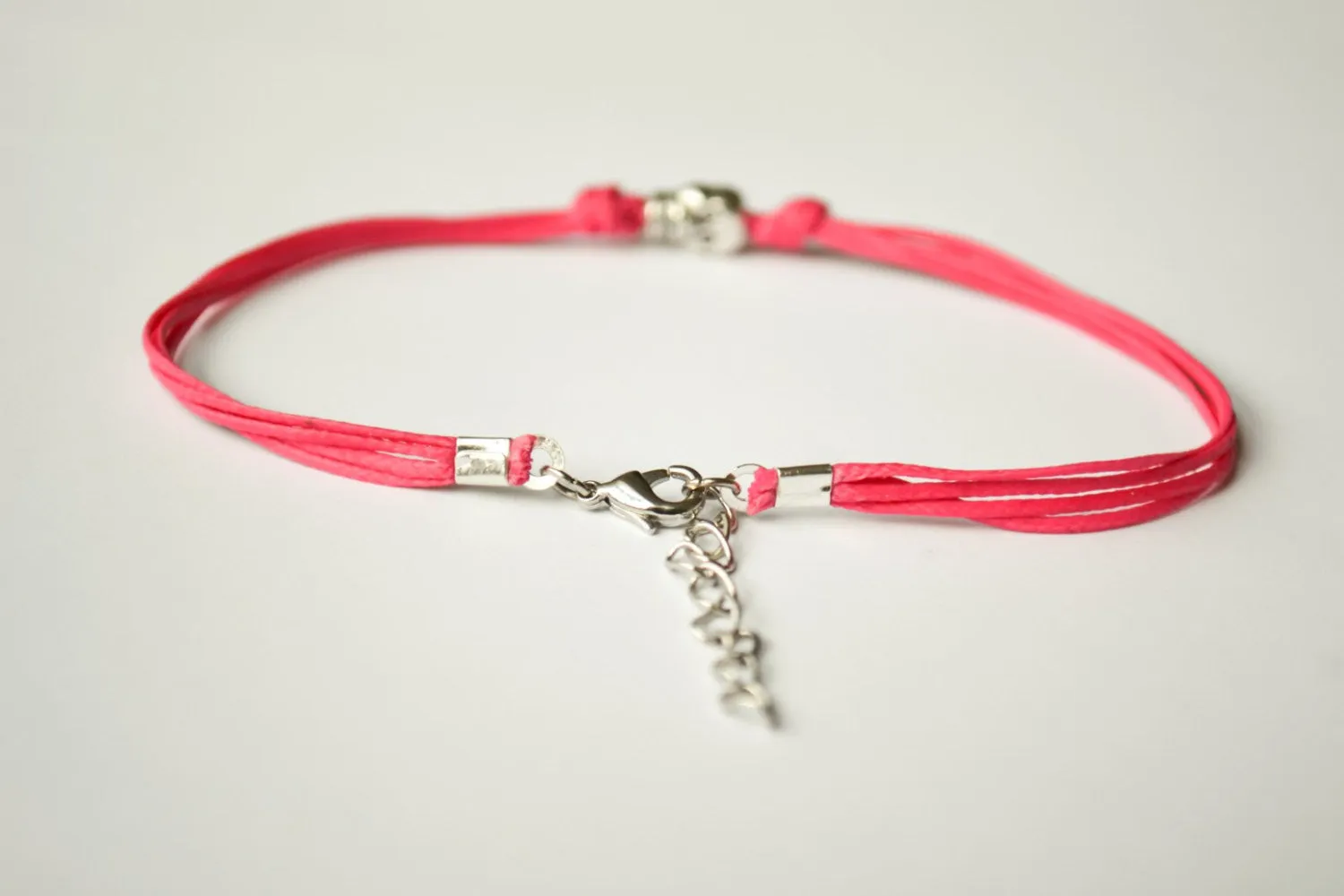 Pink cord bracelet with a silver skull bead charm, gift for her