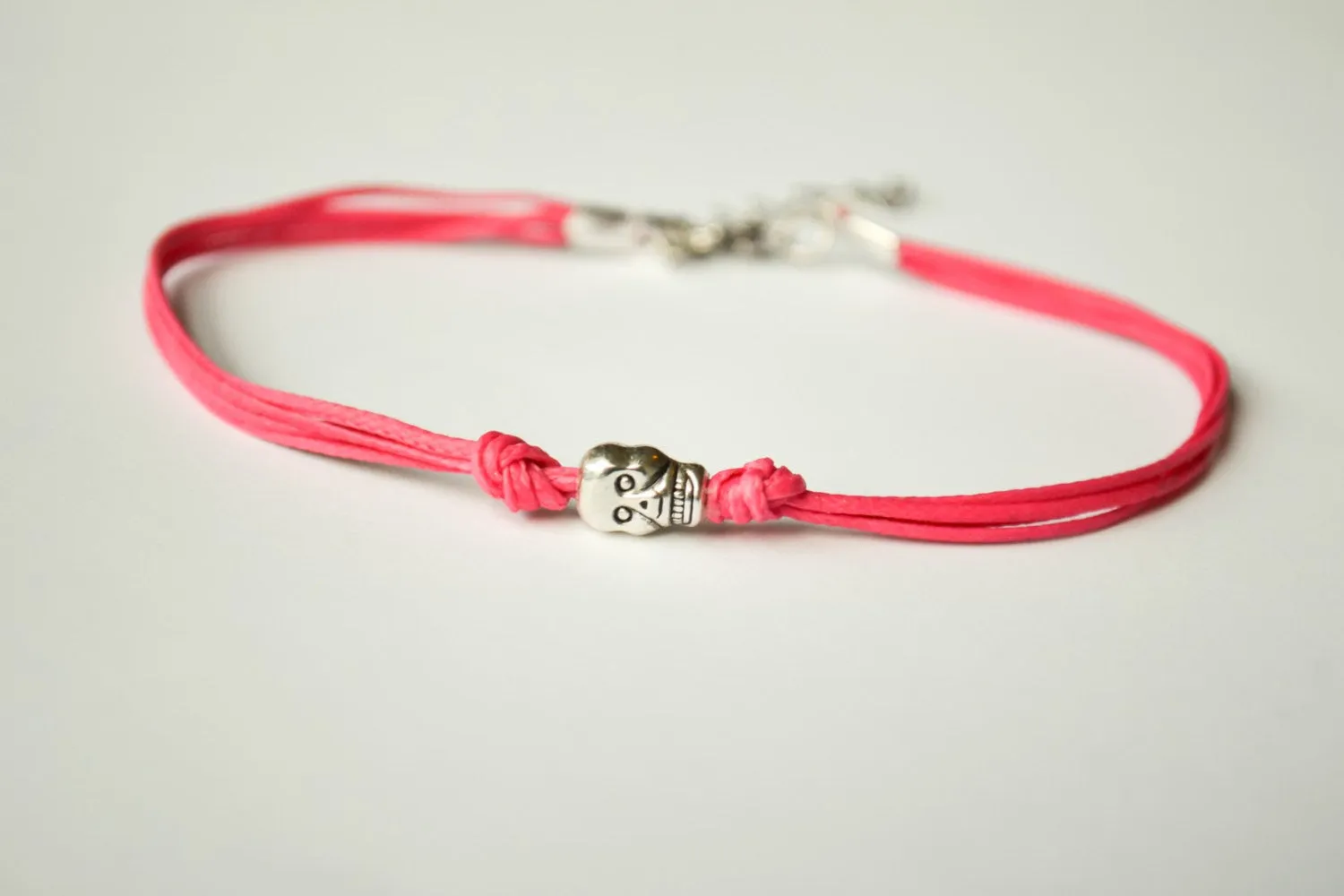 Pink cord bracelet with a silver skull bead charm, gift for her