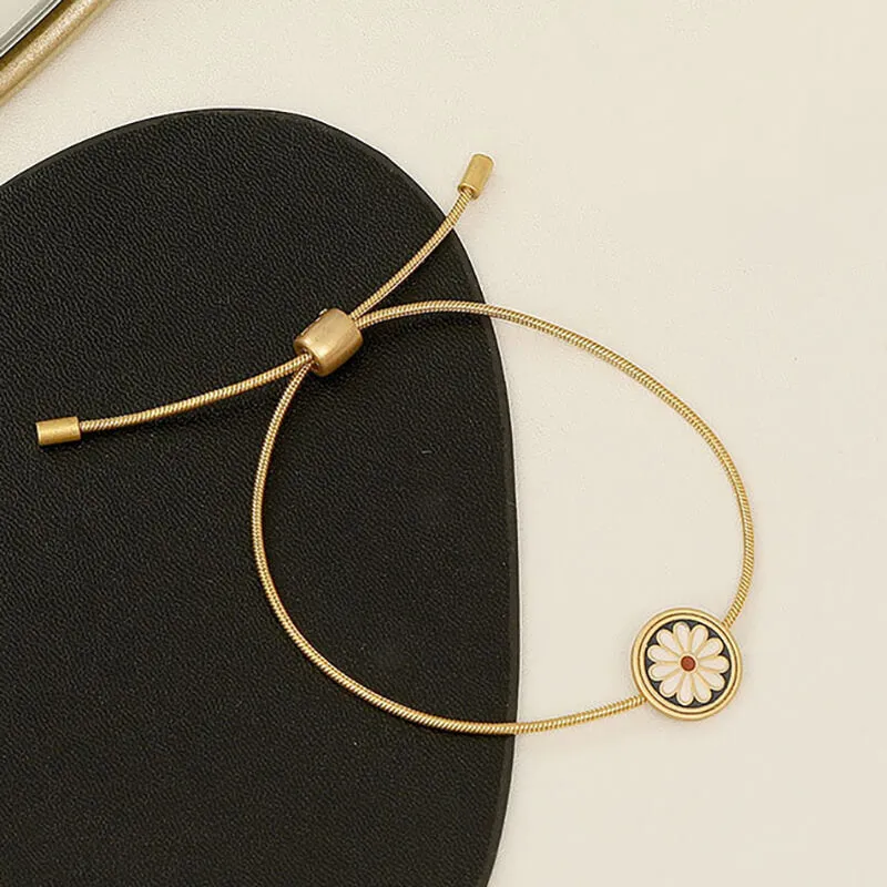 Pulseira Flor Daisy Cordão em Aço Dourada
