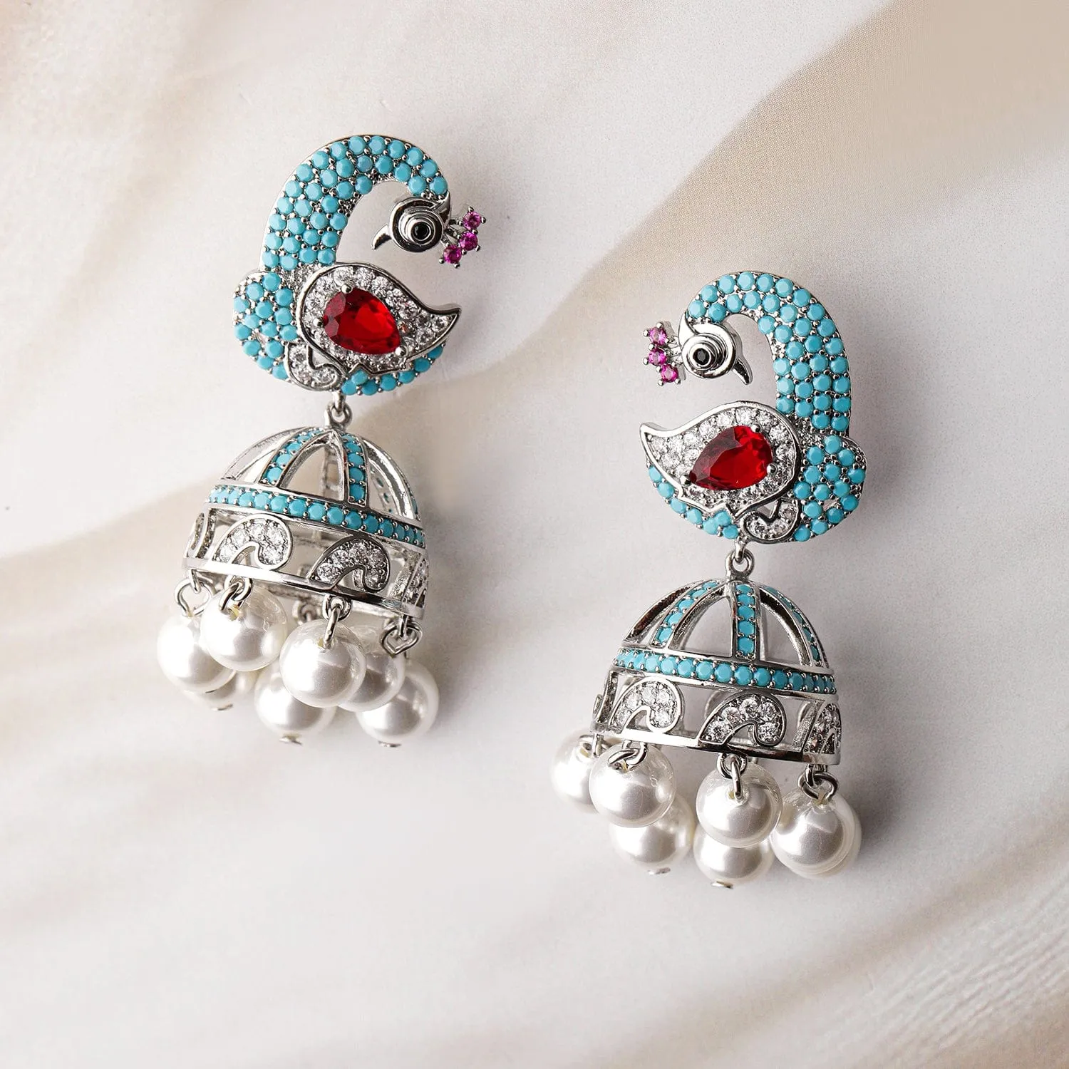 Rhodium-Plated Turquoise Blue & Ruby AD & Zirconia Studded Peacock Design Jhumka Earrings