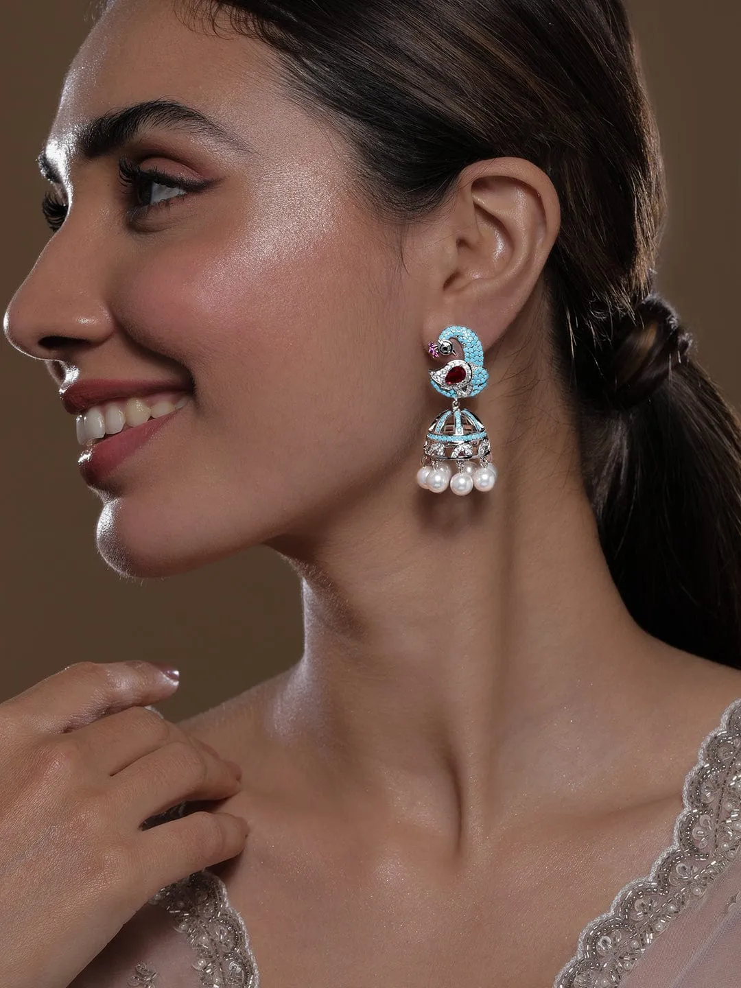 Rhodium-Plated Turquoise Blue & Ruby AD & Zirconia Studded Peacock Design Jhumka Earrings