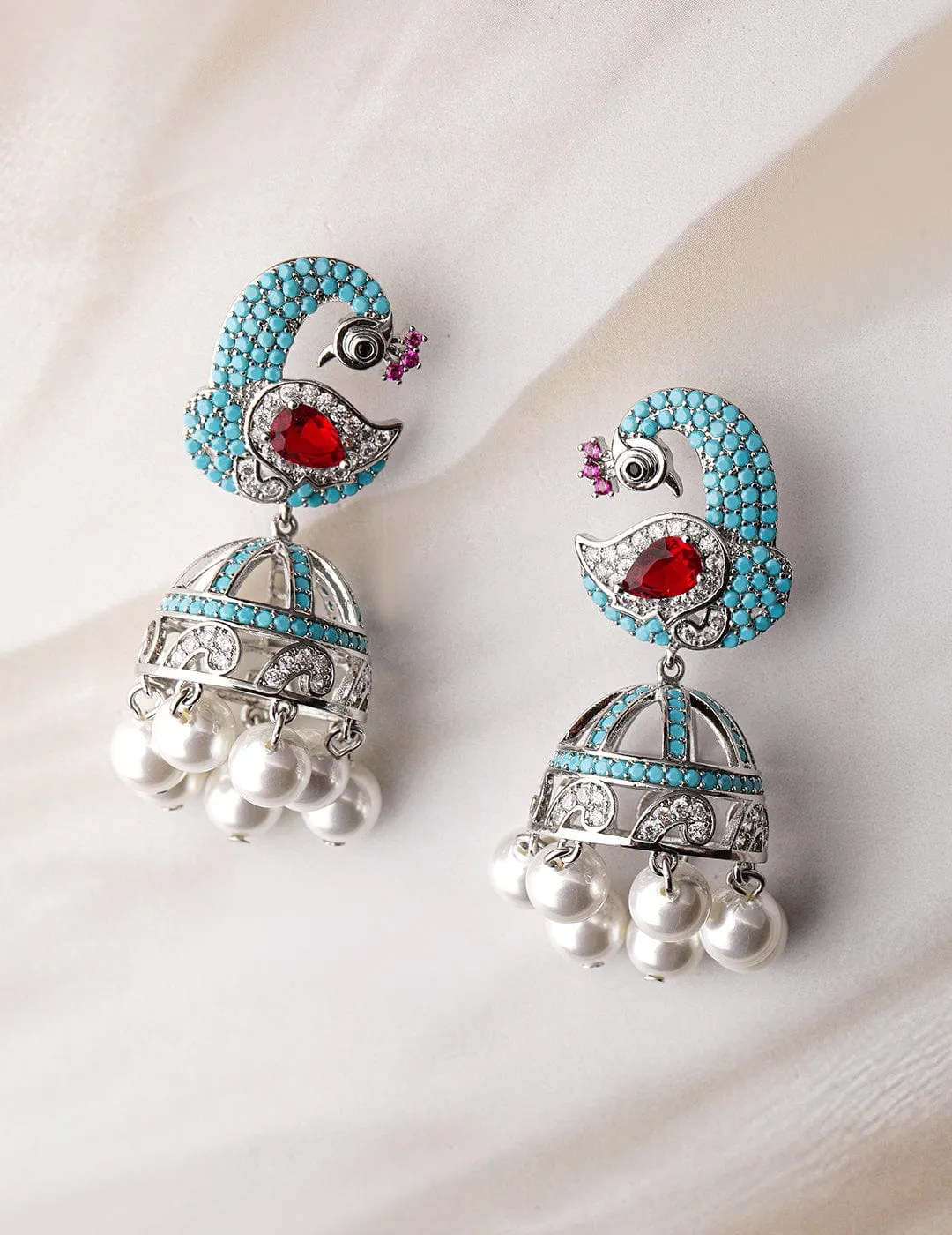Rhodium-Plated Turquoise Blue & Ruby AD & Zirconia Studded Peacock Design Jhumka Earrings